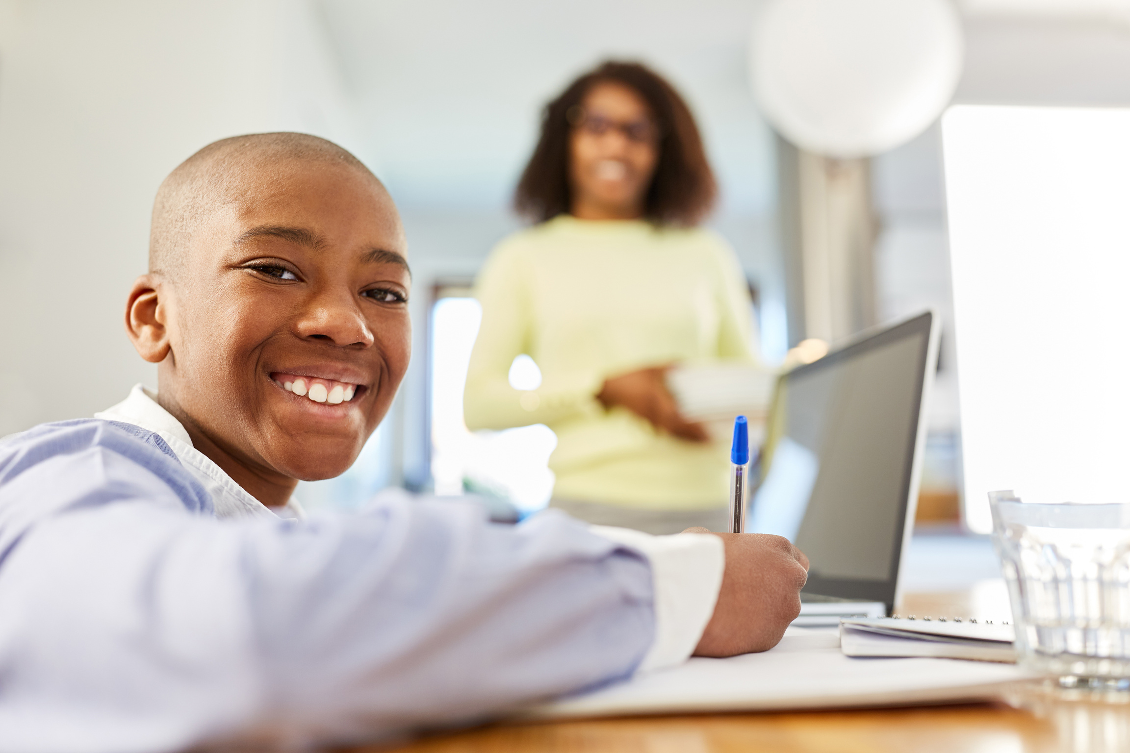 African American Student Doing Homeschooling on Laptop