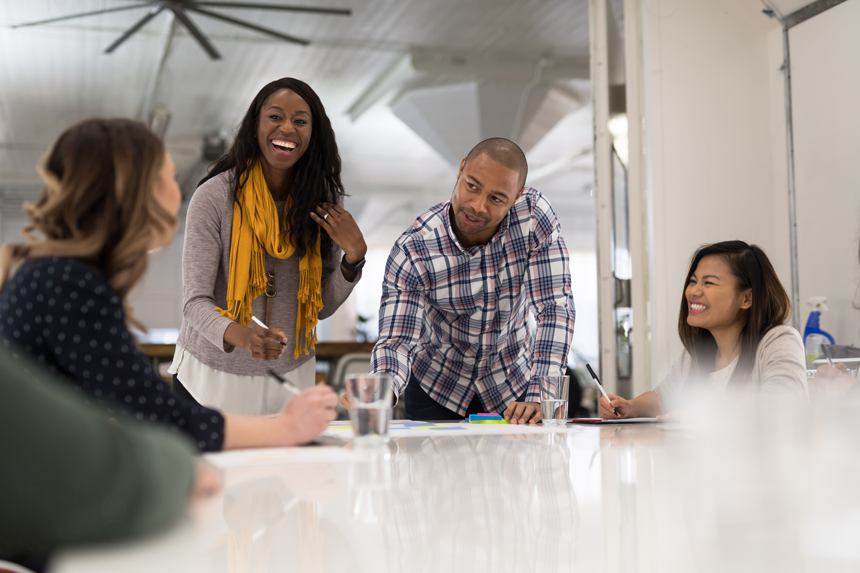 African American business owners signing paperwork in a corporate setting